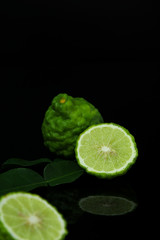 Kaffir Lime or Bergamot on black background with Copy Space for text.