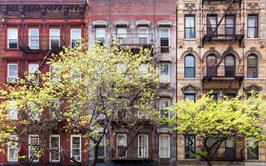 Historic old buildings and trees along 3rd Avenue in the East Village of Manhattan, New York City