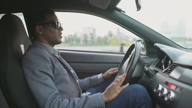 Upset And Angry Mixed Race Businessman Sitting Inside His Car Outdoors