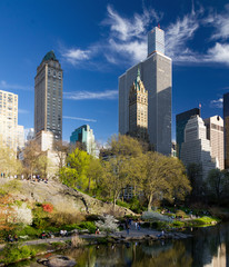 Central Park spring landscape scene with crowds of people relaxing in Manhattan, New York City