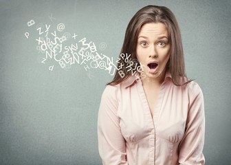 Woman talking with alphabet letters.