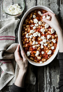 Tomato baked white beans with feta and pesto
