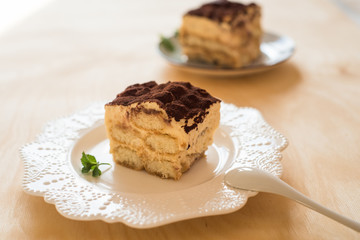 Homemade tiramisu dessert, Italian tiramisu dessert on a porcelain plate