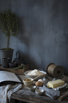 Butter, brown sugar and flour ingredients on a rustic table