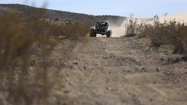 Off Road truck racing through the desert