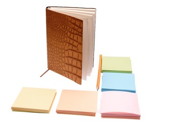 Notebook with leather cover and colored paper for writing, isolated on white background