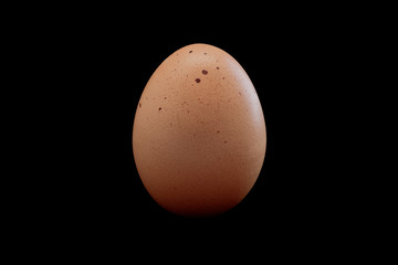 Hen egg on black background with path