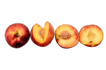 Peaches whole and sliced halves with a bone isolated on white background