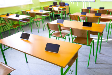 Digital tablet on the desk in classroom