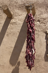 Chilli peppers 
Santa Fe (USA, New Mexico) in a street market chilli peppers hung up in group