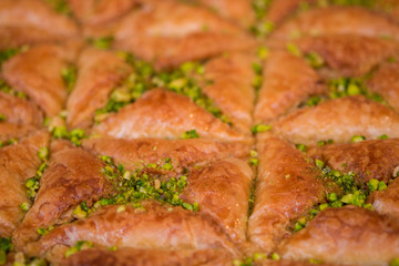 Sweet baklava with honey and pistachio nuts. Selective focus