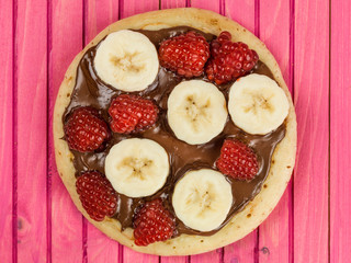 Pancakes with Chocolate Spread With Banana and Raspberries