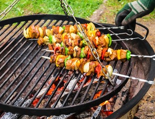 Tasty meat skewers on a charcoal grill.