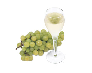 Glass of white wine and ripe organic green grapes isolated on white background