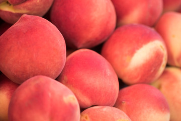 New harvest red peaches for sale at city farmers market