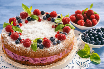 Delicious homemade cake with berry cheese cream.