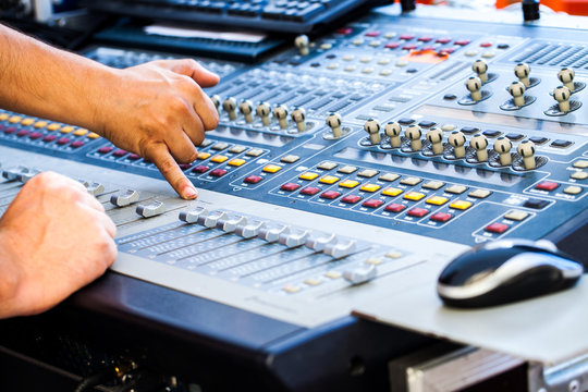 Man using mixing console