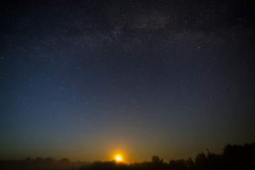 Fototapeta na wymiar Moon on the background of the starry night sky.