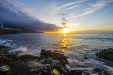 Sunset over the rocky coast of atlantic