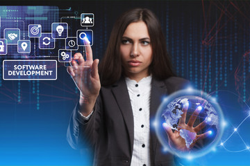 The concept of business, technology, the Internet and the network. A young entrepreneur working on a virtual screen of the future and sees the inscription: Software development