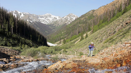Fototapeta na wymiar A Woman Hikes the Silver Creek Trail
