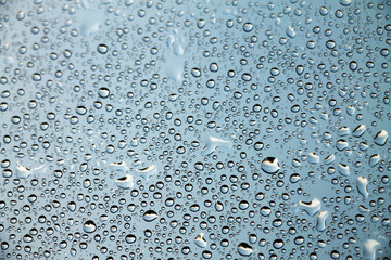 Raindrops on window glass , rainy day