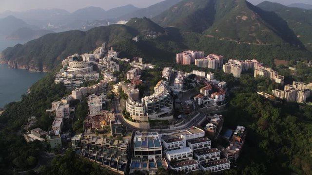 Hong Kong Aerial v145 Flying low over Chung Hom Kok area panning with island views