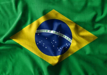 Foto auf Acrylglas Brasilien Brasilien-Flaggenmalerei auf hohem Detail der Wellenbaumwollstoffe.