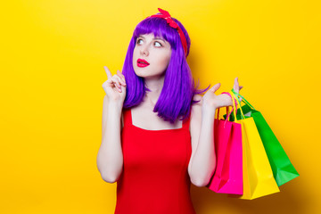 girl with purple color hair and shopping bags