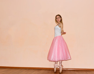 young dancer warming up at the gym doing dance moves