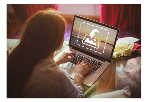 User with Laptop on Bed Mockup 1