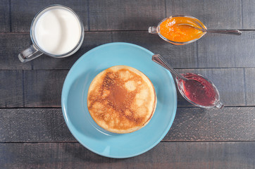 Small pancakes on a blue plate