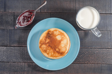 Small pancakes on a blue plate