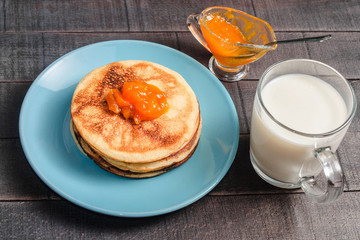Small pancakes on a blue plate