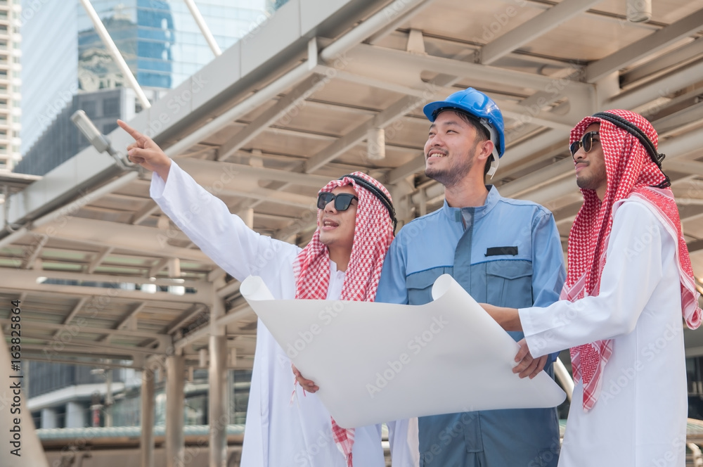 Wall mural arabian business people working with architect engineer.