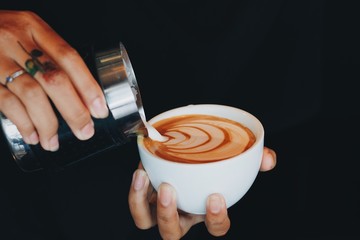 Coffee cup latte art in coffee shop 