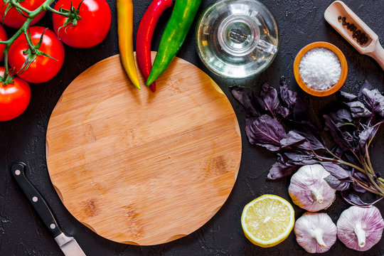 Mockup For Menu. Cutting Board And Vegetables On Wooden Table Background Top View