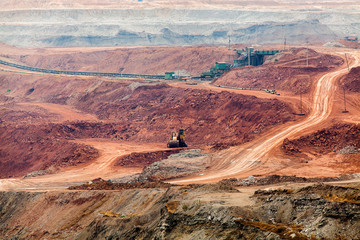 Part of a pit with big mining truck working