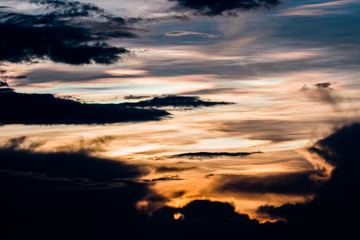 colorful dramatic sky with cloud at sunset.