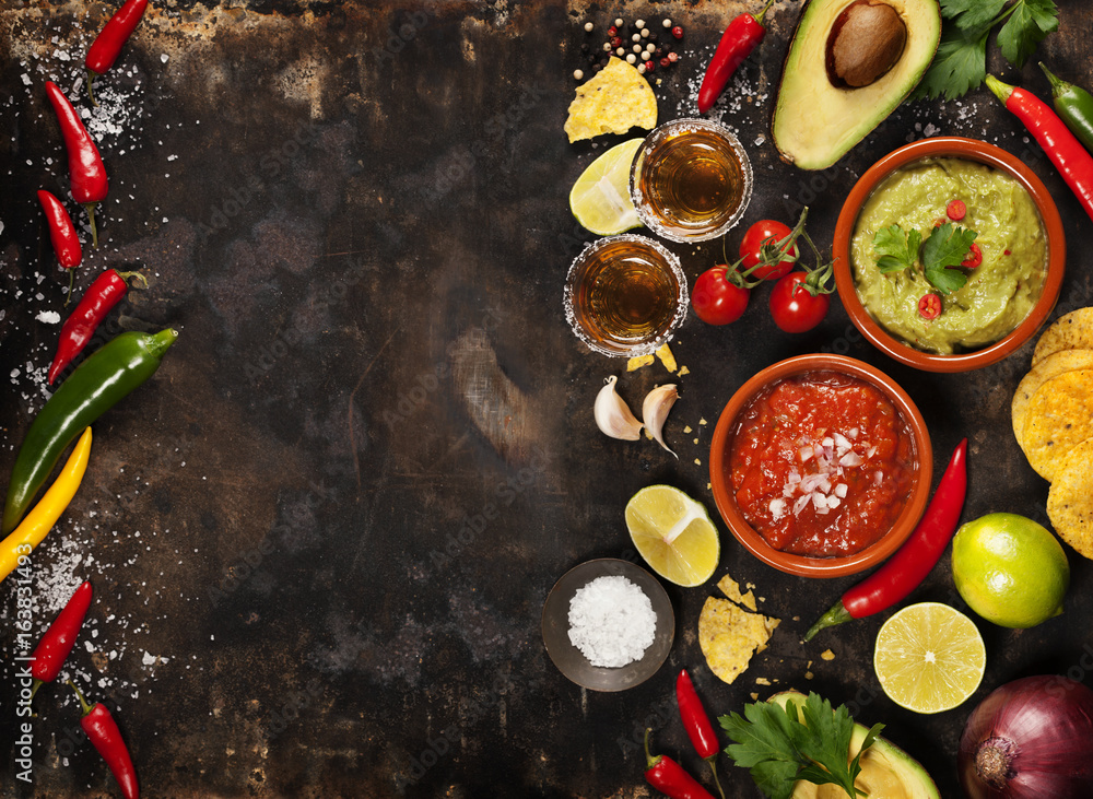 Wall mural Green Homemade Guacamole with Tortilla Chips, Salsa and tequila shots