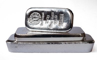 Three silver bars of different weight.