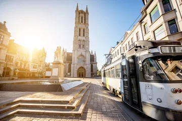 Foto op Canvas View on the saint Bavo square with cathedral and old tram during the sunrise in Gent city, Belgium © rh2010