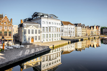 Obraz premium Riverside view with beautiful old buildings and water channel during the morning light in Gent city, Belgium