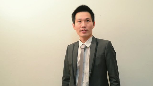 Asian businessman waiting for colleague