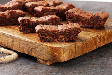 Brownie stack, chocolate cake on rustic wooden board