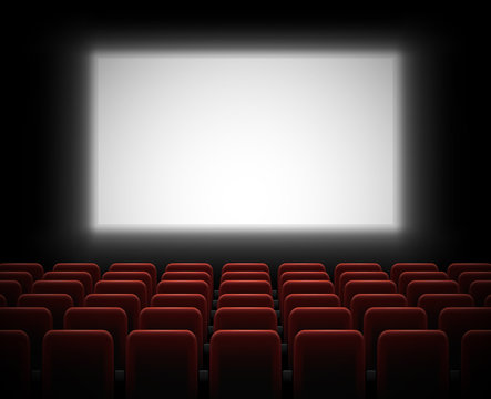 Cinema hall with glowing blank screen