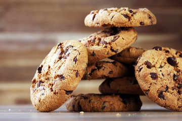 Chocolate cookies on wooden table. Chocolate chip cookies shot