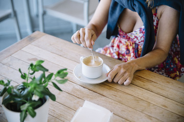 Woman Holding a Cup of Coffee