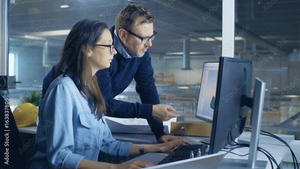 Poster female industrial technician and male chief engineer designing 3d turbine/ engine model with help of
