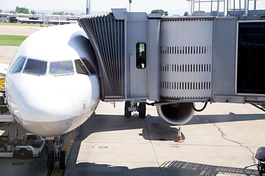 Boarding bridge docked with aircraft